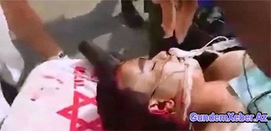 ŞOK: Dünya İsrailə tüpürdü – Polisin gözü önündə canverən uşağın üzünə donuz əti sürtdülər (Video izlə)